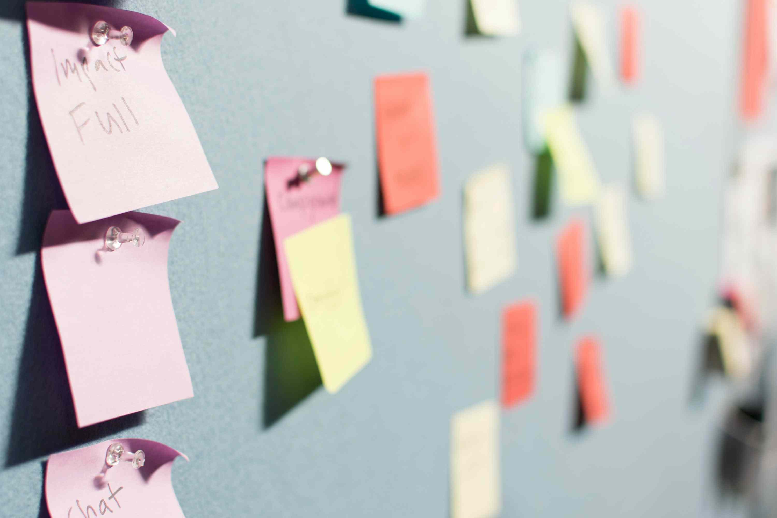 An array of post-it notes on a board for a strategy or planning meeting